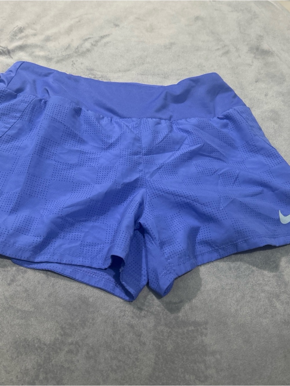 Nike Dri-FIT perforated checked athletic shorts in a vibrant blue-purple colorwa